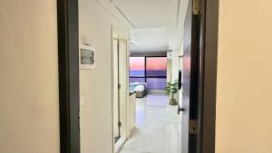 a hallway leading to a room with a view at Amber – 10th Floor Sea View Studio, Kaslik in Jounieh