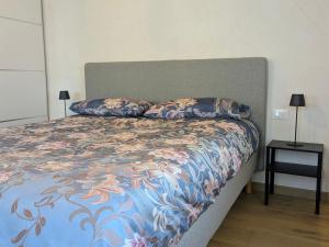 a bed with two pillows on it in a bedroom at Locanda alla Nave in Pianzano