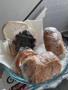 three pastries in plastic bags on a glass plate at Abbey Meadows View ABB in Redditch +19 photos