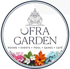 a sign for a garden with flowers in a circle at Ofra Garden in Pondicherry