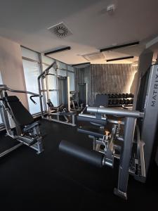 a gym with several tread machines in a room at APT. 539 in Dziwnówek