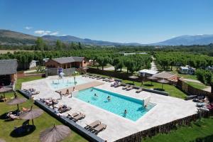an aerial view of a pool at a resort at Bungalows Pirineus in Guils de Cerdaña