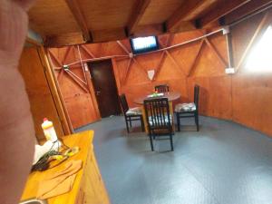 an inside view of a room with a table and chairs at Domo Premium in Esquina