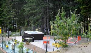 a garden with a hot tub in a park at Podere il Corniolino in Poppi