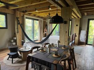 a room with a bed and a hammock in it at KINEKI La Punta - Casa Karen in Brisas de Zicatela