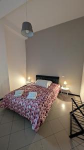 a bedroom with a large bed in a room at White House B&B in Melfi