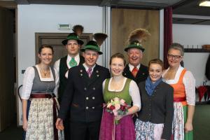 a group of people dressed in costumes posing for a picture at Mayringerlehen in Ramsau