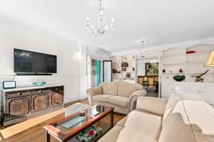 a living room with a couch and a table at Villa Atajate Secret by SuperHosts in Atajate
