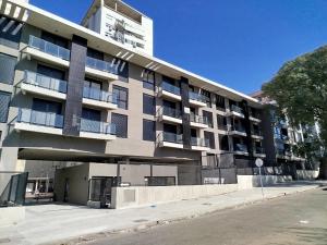 an apartment building on the side of a street at let health flow in Montevideo