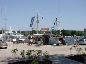 a marina with boats in the water and people walking at Ferienwohnung 7 Katharina mit Balkon in Lauterbach +32 photos