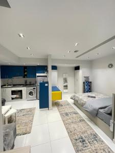 a large room with a bed and a kitchen at Luxury Studio House 589-5 in 6th Of October