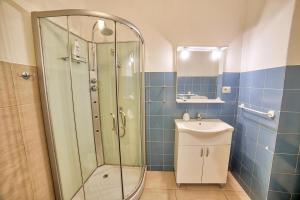 a bathroom with a shower and a sink at Lemon Home in Olbia