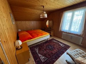 a bedroom with a bed in a wooden room at Staldenried Ferienwohnung in Staldenried