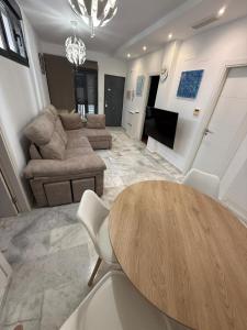 a living room with a table and a couch at Serenity Gelves in Gelves