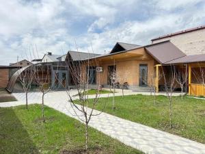 a house with trees in front of it at Home Comfort in Kotaykʼ