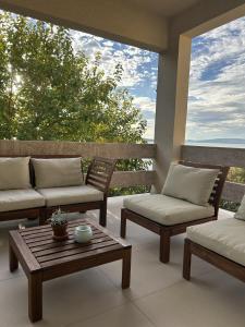 a patio with two couches and a coffee table at Zara 1 in Kruševo