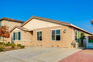 a house with a driveway in front of it at Great for Digital Nomads! Convenient Manteca Apt in Manteca