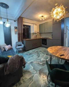 a living room with a floor covered in marble at GZP Residence Lugoj 4 in Lugoj +3 photos