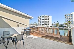 a patio with a table and chairs on a balcony at Emerald Breeze in Destin