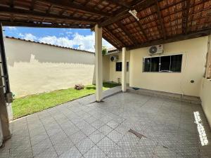 an outside view of a house with a patio at Casa no Centro in Corumbá