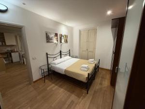 a bedroom with a bed in a room at Sotto il Borgo Apartments in Iesi