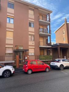 three cars parked in front of a building at Piccolo Paradiso in Novara