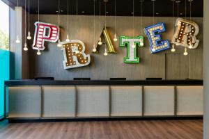 a row of signs that say rock and roll at Motel One Wien-Prater in Vienna