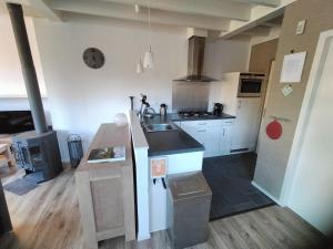 a kitchen with a sink and a counter top at Chalet in Tyrol near Ski Slope in Stramproy
