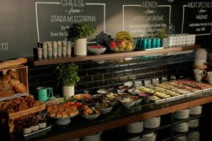 a bakery with a bunch of different types of food at The Cloud One Gdansk in Gdańsk