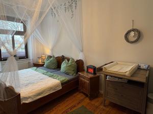 a bedroom with a bed and a window at Wohnen in der ehemaligen Bauernstube in Treia