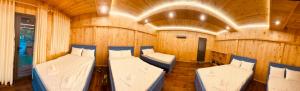 a room with two beds in a boat at Homestay CÂY THỊ in Tây Ninh