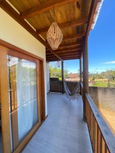 a porch of a house with a hammock at Vila Baião - Casa Luiz Gonzaga in Itacaré +22 photos