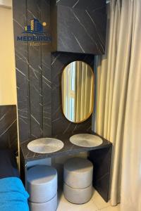 a bathroom with two stools and a mirror at Apartment 201 / Oceanfront / Mirrored Bed / Kitchen in João Pessoa