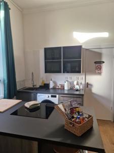a kitchen with a table and a counter top at Baile Apartment Central Inverness in Inverness +8 photos