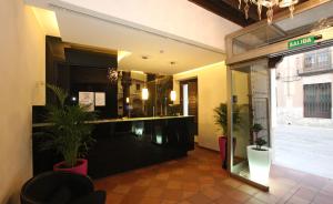 The lobby or reception area at Evenia Alcalá Boutique Hotel