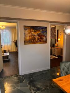 a living room with a painting on the wall at GZP Residence Lugoj 14 in Lugoj