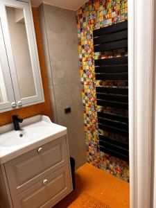 a bathroom with a sink and a shower at GZP Residence Lugoj 14 in Lugoj