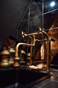 a kitchen sink with a faucet on a counter at Romantic AFrame Cabin with Firepit, BBQ in Pocono Pines +70 photos