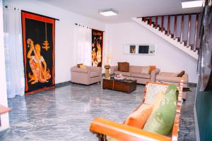 a large living room with couches and a staircase at Sella Villa-Transit Airport in Seeduwa