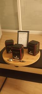 three boxes on a plate on a table at Loft 212 in Chitenay