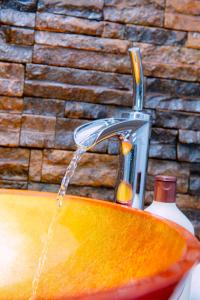 a stream of water coming out of a sink at Sella Villa-Transit Airport in Seeduwa +243 photos