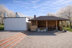 a building with a pavilion with a patio at Livada Luxurious Bungalow in Livada
