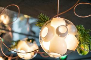 a glass christmas ornament hanging from a ceiling at Motel One Berlin-Mitte in Berlin +44 photos