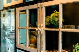 a cabinet with a window with a plant in it at Motel One Berlin-Hackescher Markt in Berlin +37 photos