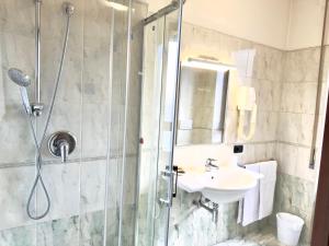 a bathroom with a shower and a sink at Hotel Molise 2 in Milan