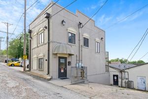 a building on the side of a street at Contemporary Dual-Unit 2BR Downtown Branson - Free Tickets Included - LOFT in Branson