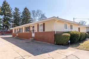 a yellow and red house with a driveway at Akron 2 Bed 1 Bath Mountain Oasis Dog Friendly in Akron