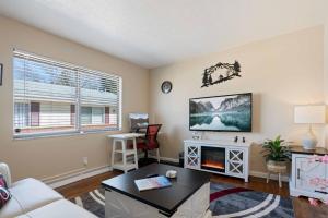 a living room with a couch and a fireplace at Akron 2 Bed 1 Bath Mountain Oasis Dog Friendly in Akron