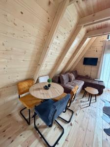 a living room with a couch and a table at Vila Mia in Žabljak