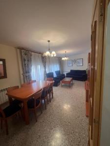 a living room with a table and a couch at Apartamento Pedro de Cella in Cella